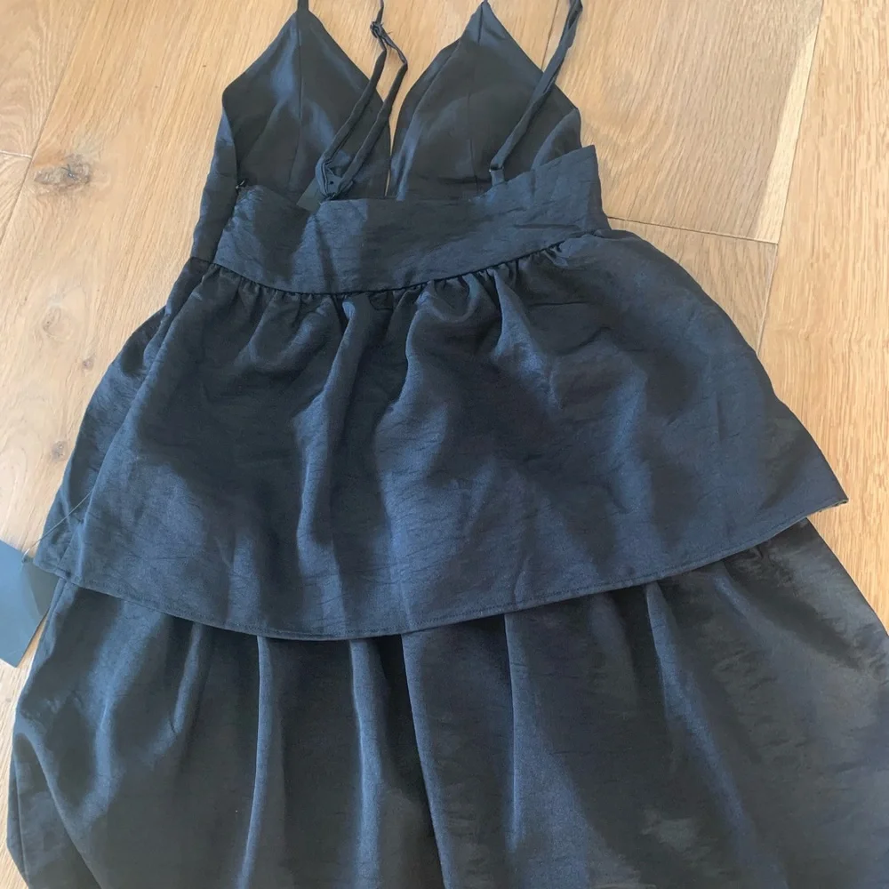 New With Tags! Lulu’s little black dress XS Party Pose Satin tiered min dress. - Picture 7 of 7